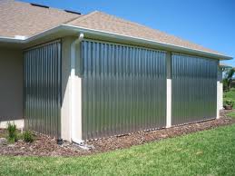 Corrugated aluminum storm panels covering a home's windows